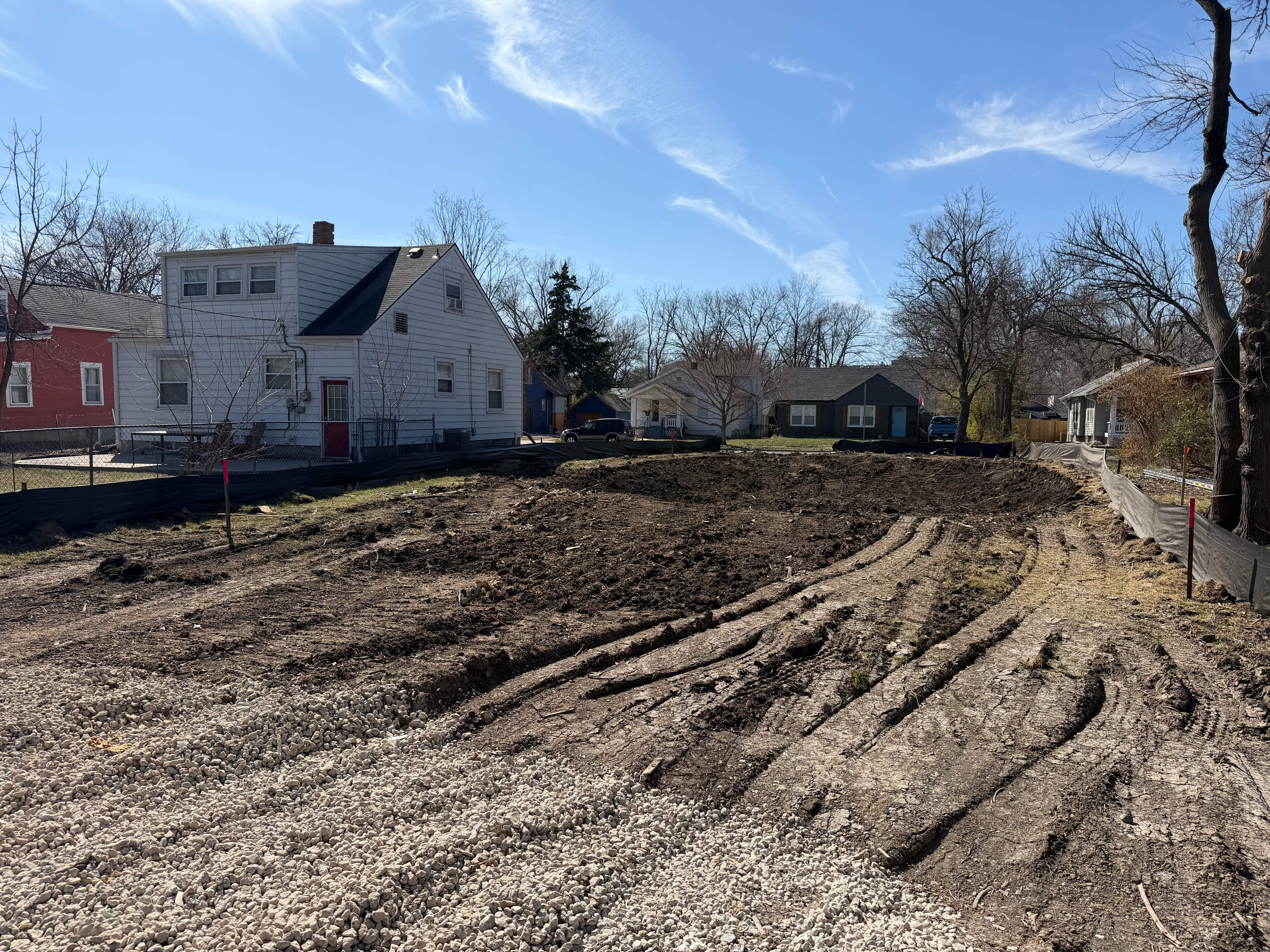Wide view of the fully cleared lot ready for foundation