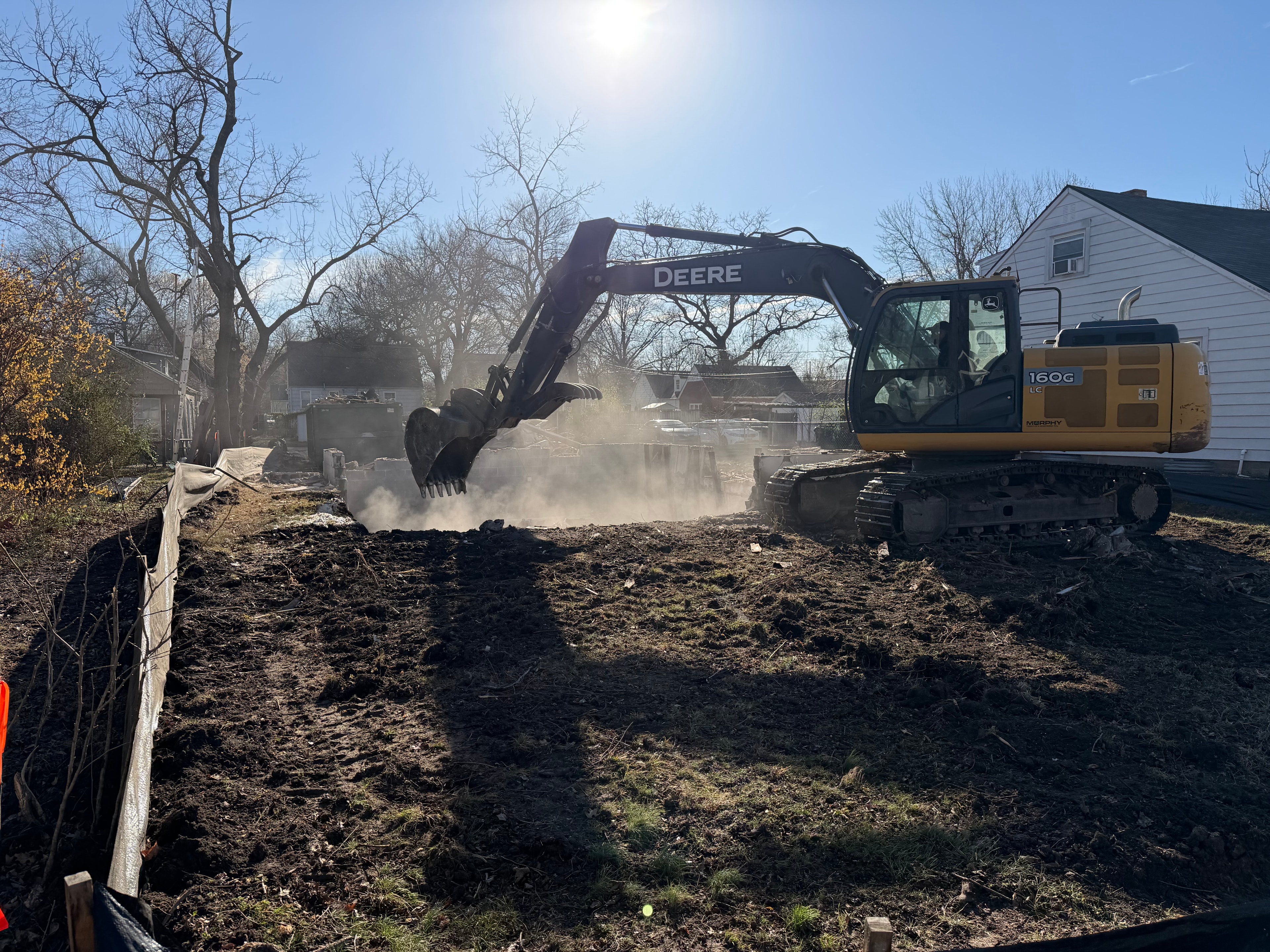 Excavator working the soil during ground breaking