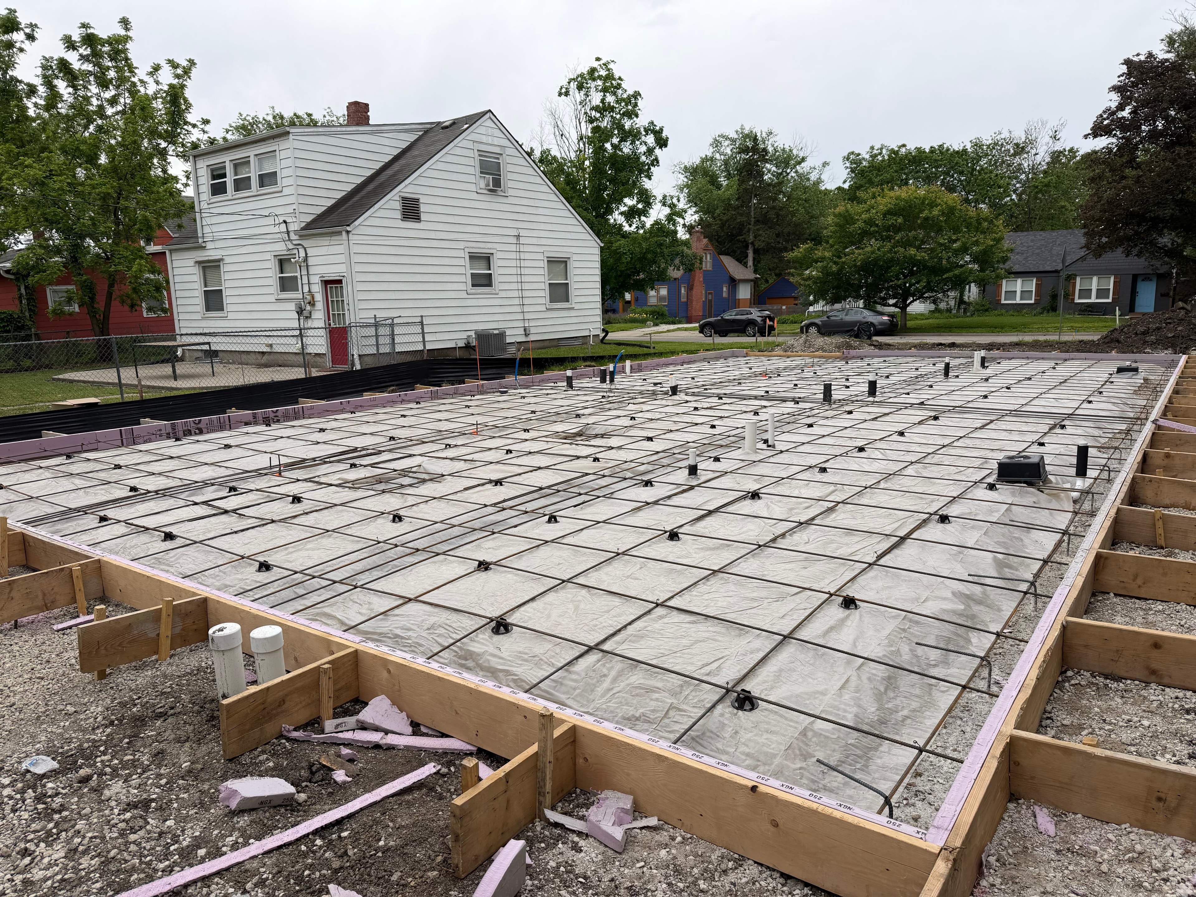 Rebar grid and vapor barrier in place, ready for concrete